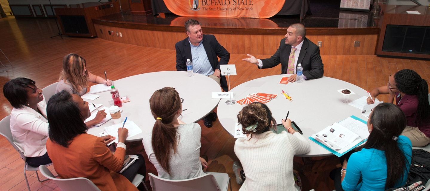 Students at a roundtable discussion